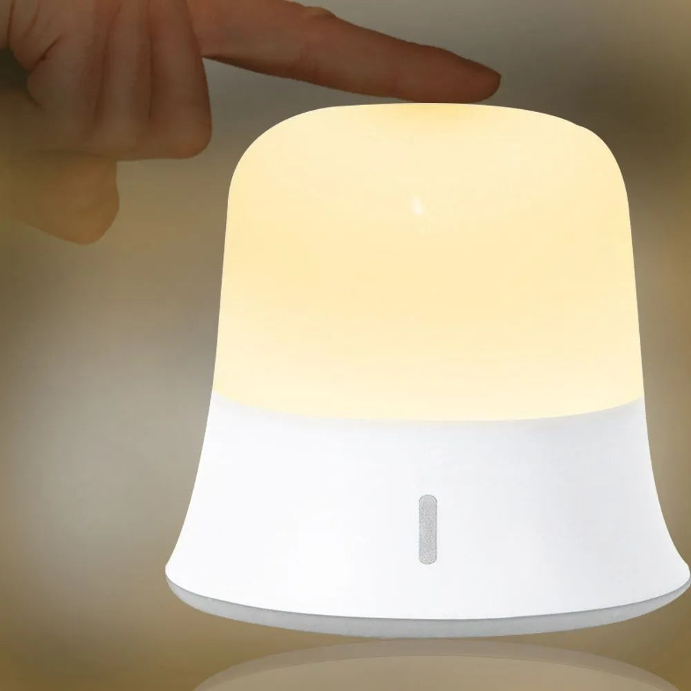 White bedside night light with touch controls for dimming and colour changing
