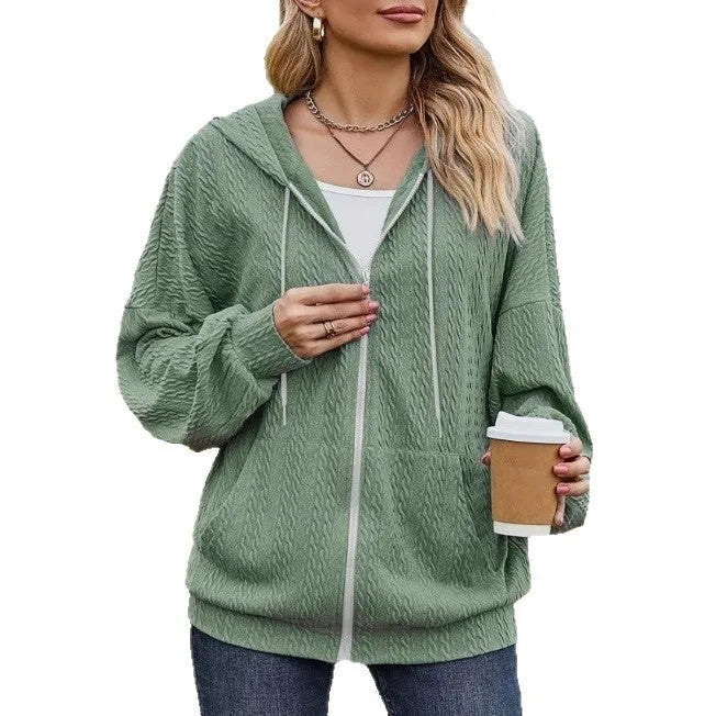Green women's hooded zipper coat with a loose fit and long sleeves.