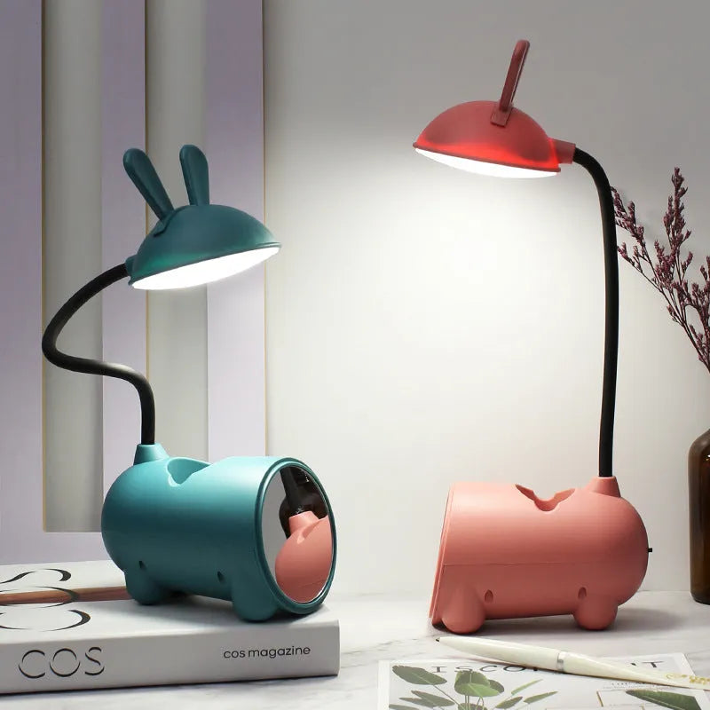 Green cartoon USB desktop lamp with pen storage container on wooden desk