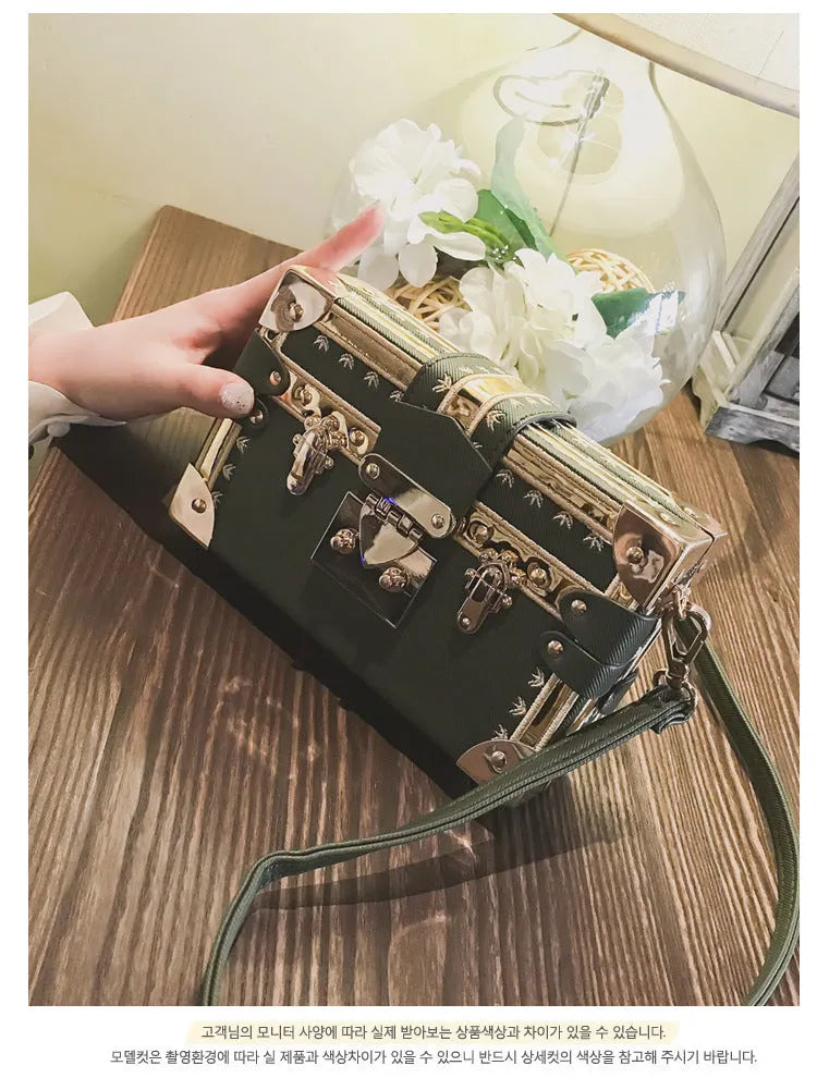 Hard structured women's shoulder bag in PU leather with single strap and flap design