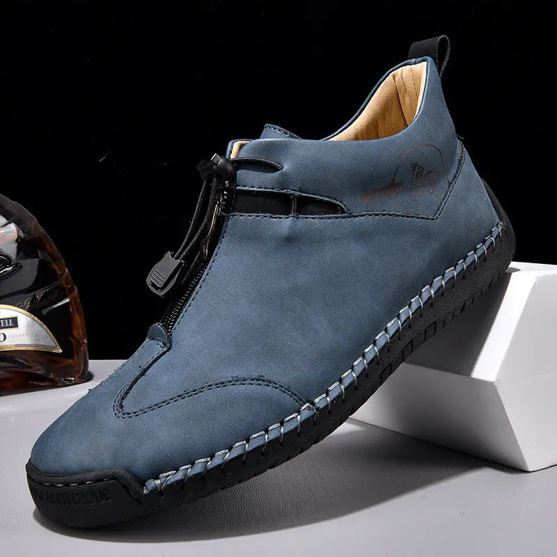 Casual men's leather shoe in green with round toe, mid heel, and decorative stitching