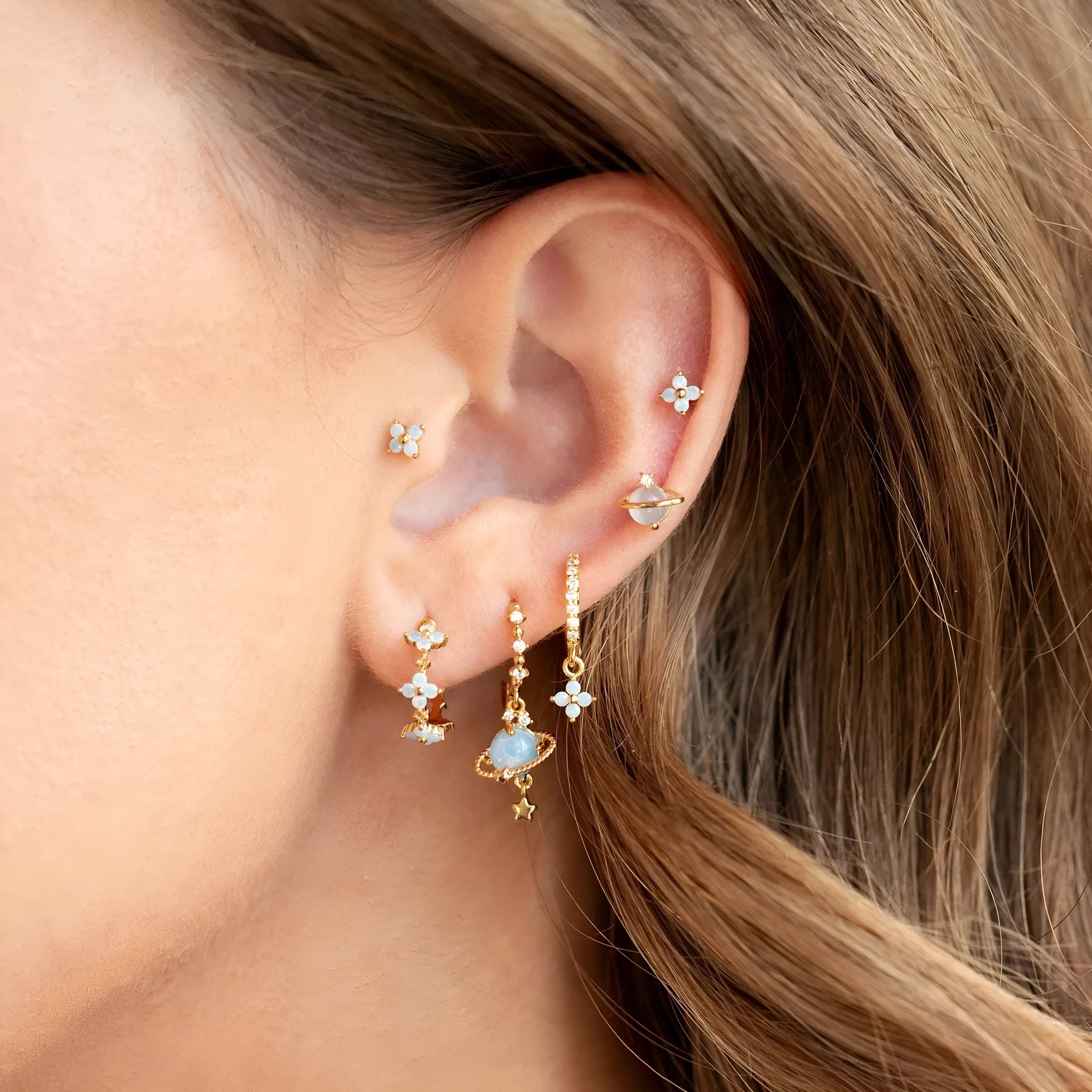 Gold and silver floral ear studs with zircon mosaic stones and geometric metal design