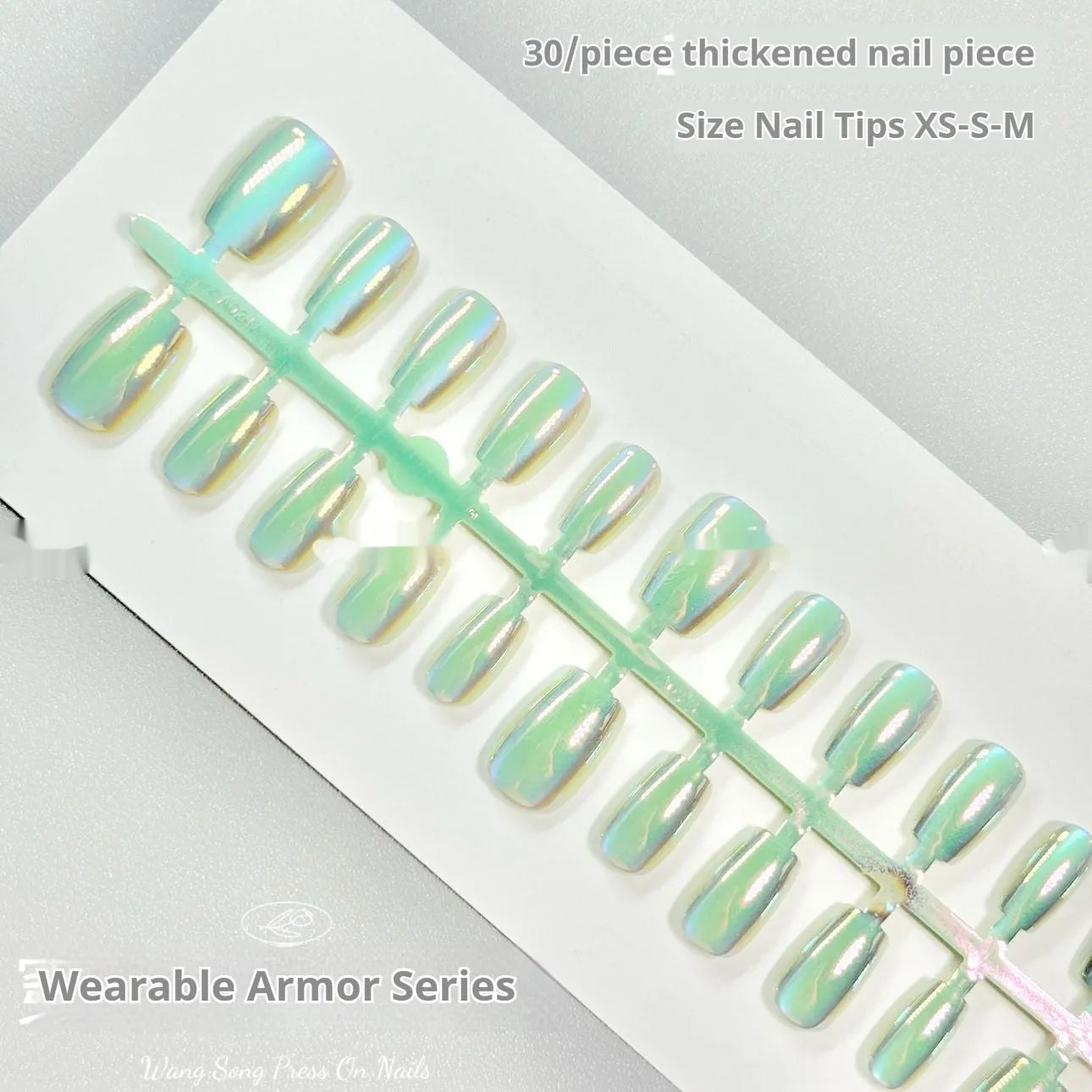 Set of electroplated Cat's Eye false nails showing Aurora armour and solid colour finishes on a hand.