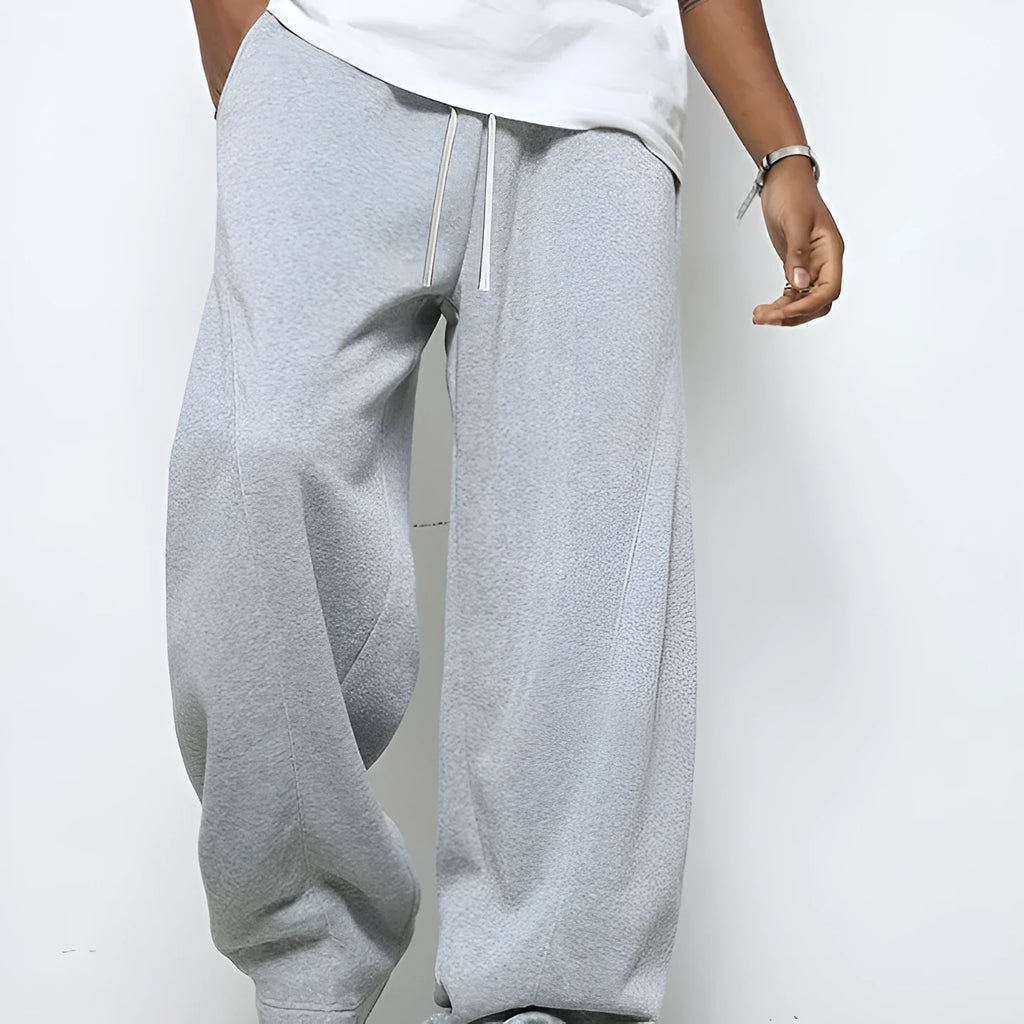 Men's solid colour straight leg casual trousers with a drawstring waistband.