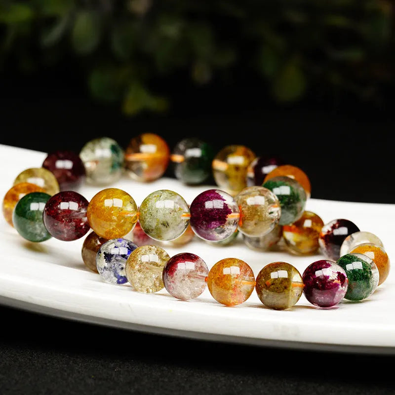 Ethnic style crystal bracelet with 10mm ball beads and colourful ghost cornucopia design.