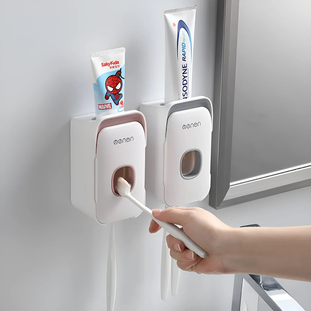 Automatic toothpaste dispenser in blue colour mounted on bathroom wall
