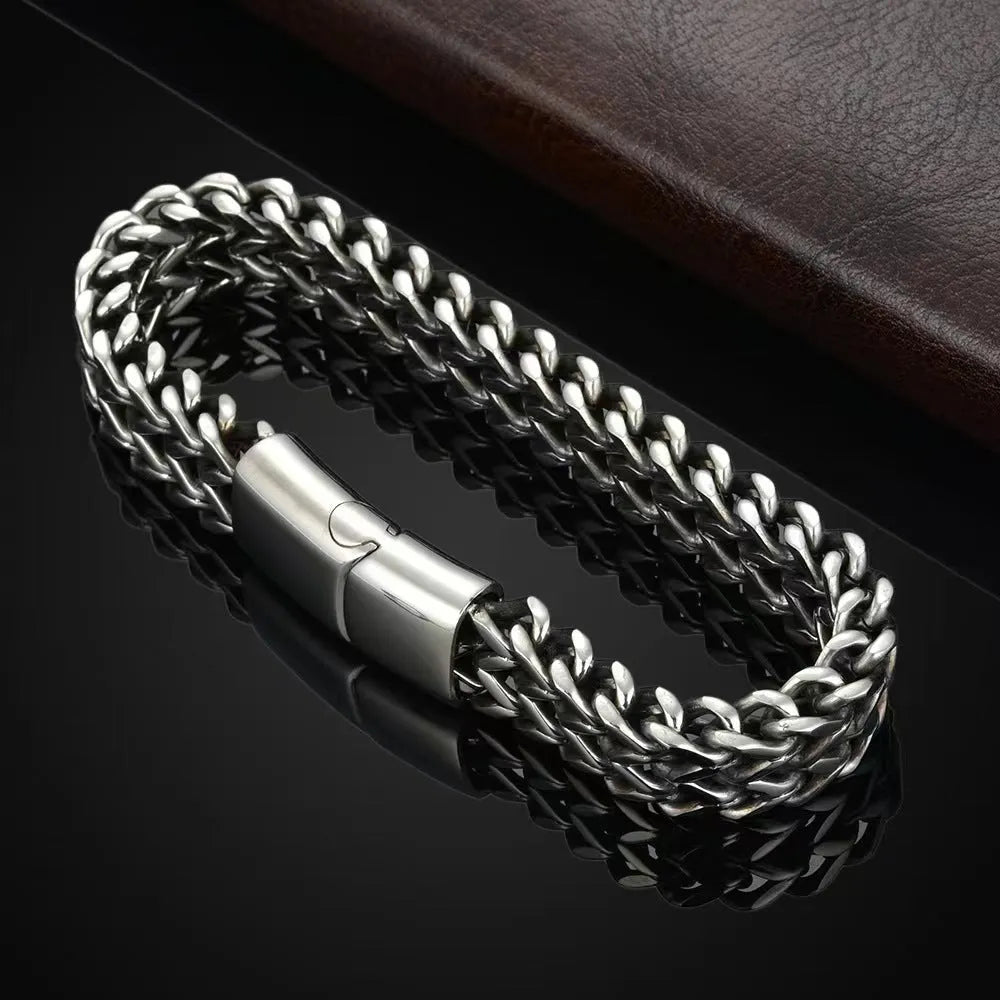 Silver stainless steel men's bracelet with geometric links, showing hip hop style on a wrist.