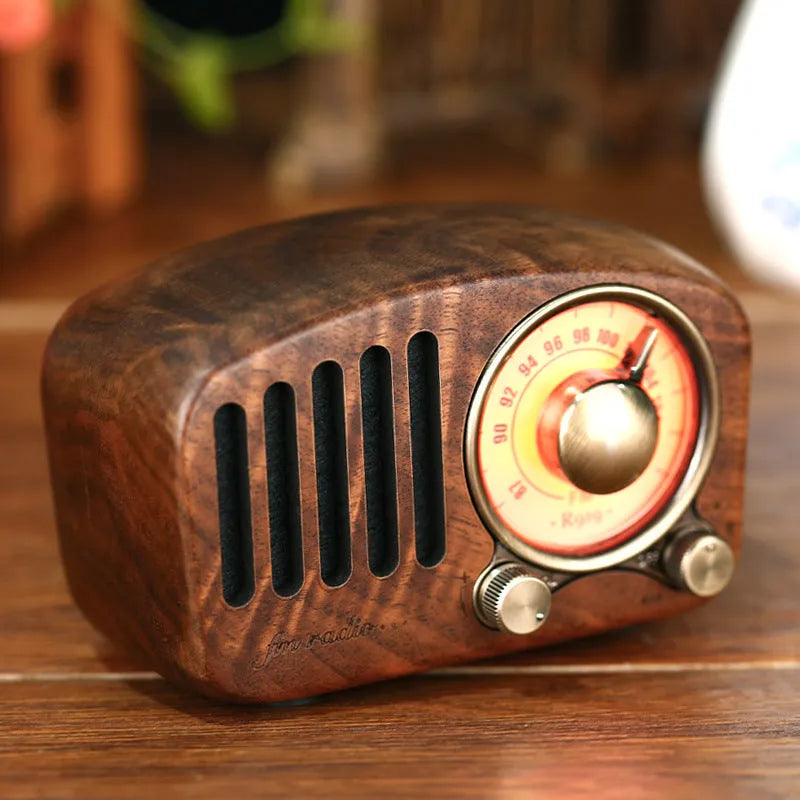 Retro wooden wireless mini speaker showing wood grain texture and compact size