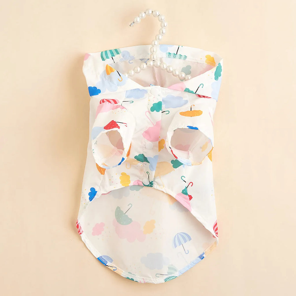 Colourful cartoon umbrella pattern dog raincoat in polyester fabric shown in multiple pet sizes