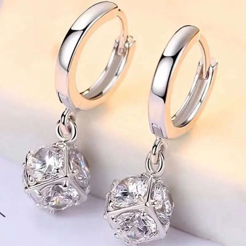 Women's copper geometric earrings with electroplated zircon finish in multiple colour variations