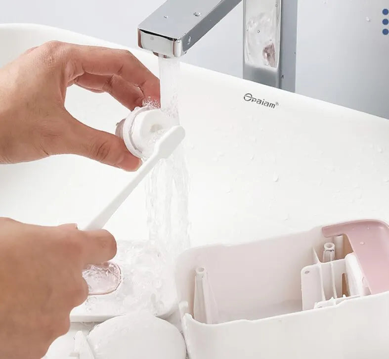 Automatic toothpaste dispenser in blue colour mounted on bathroom wall