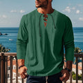 Men's loose solid colour cotton linen beach shirt in a pullover style on a hanger.
