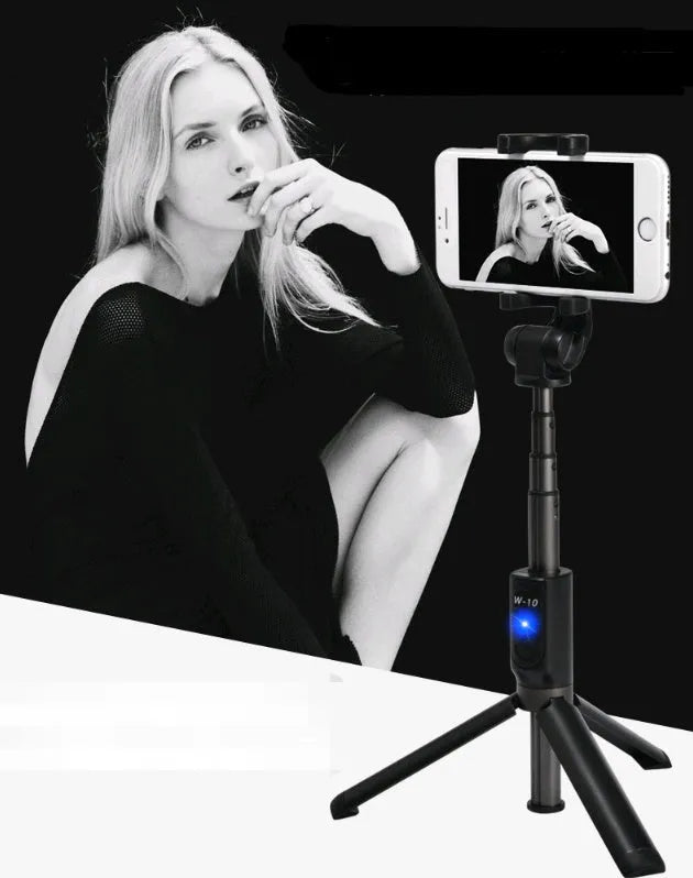 Black aluminium alloy Bluetooth selfie stick with tripod bracket extended, holding smartphone