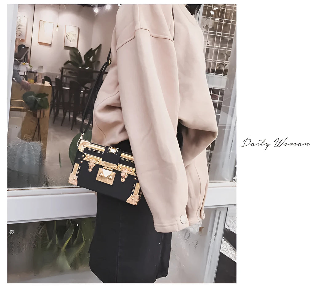 Hard structured women's shoulder bag in PU leather with single strap and flap design