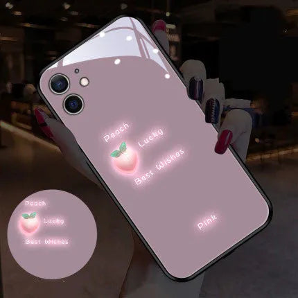 White iPhone case with painted daisy design and illuminated voice-activated colour light.