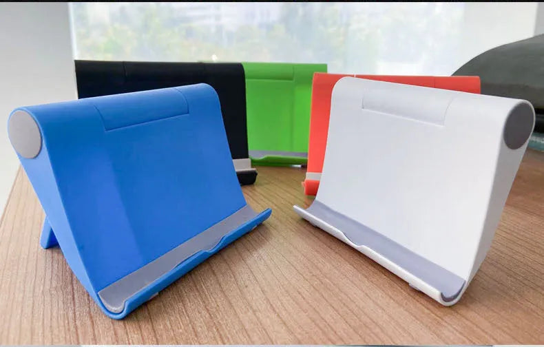 Black PE folding mobile phone stand holding a tablet at an angle on a desktop.
