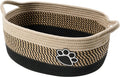 Light beige handmade cotton rope storage basket with wooden details and a handle.