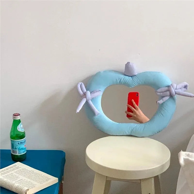 Korean-style wall mirror with aluminium lens and fabric cushion backing in apple green colour