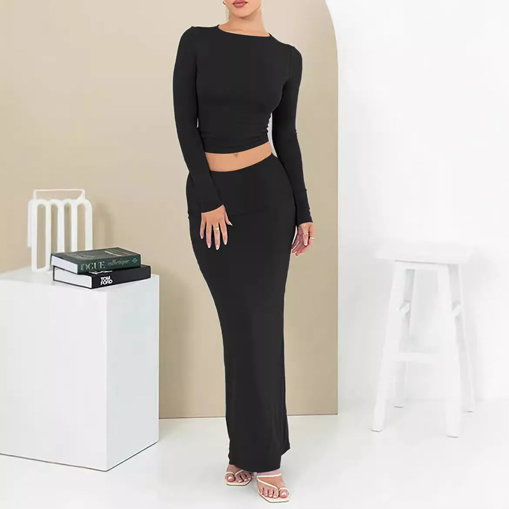 Women's black polyester two-piece suit with a top and long skirt for autumn.