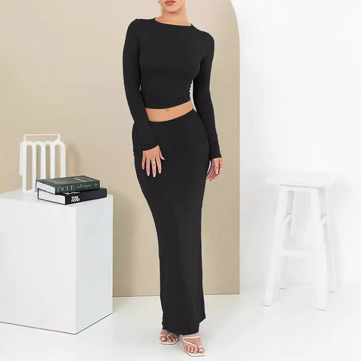 Women's black polyester two-piece suit with a top and long skirt for autumn.