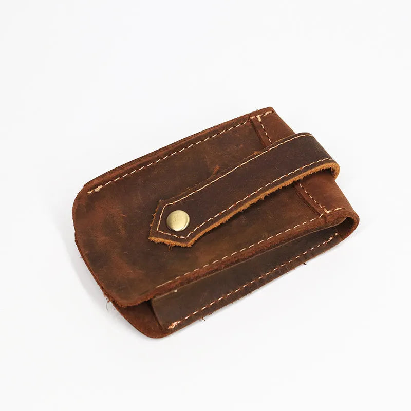 Crazy horse leather key case in dark brown, 7cm by 11.5cm, resting on a surface