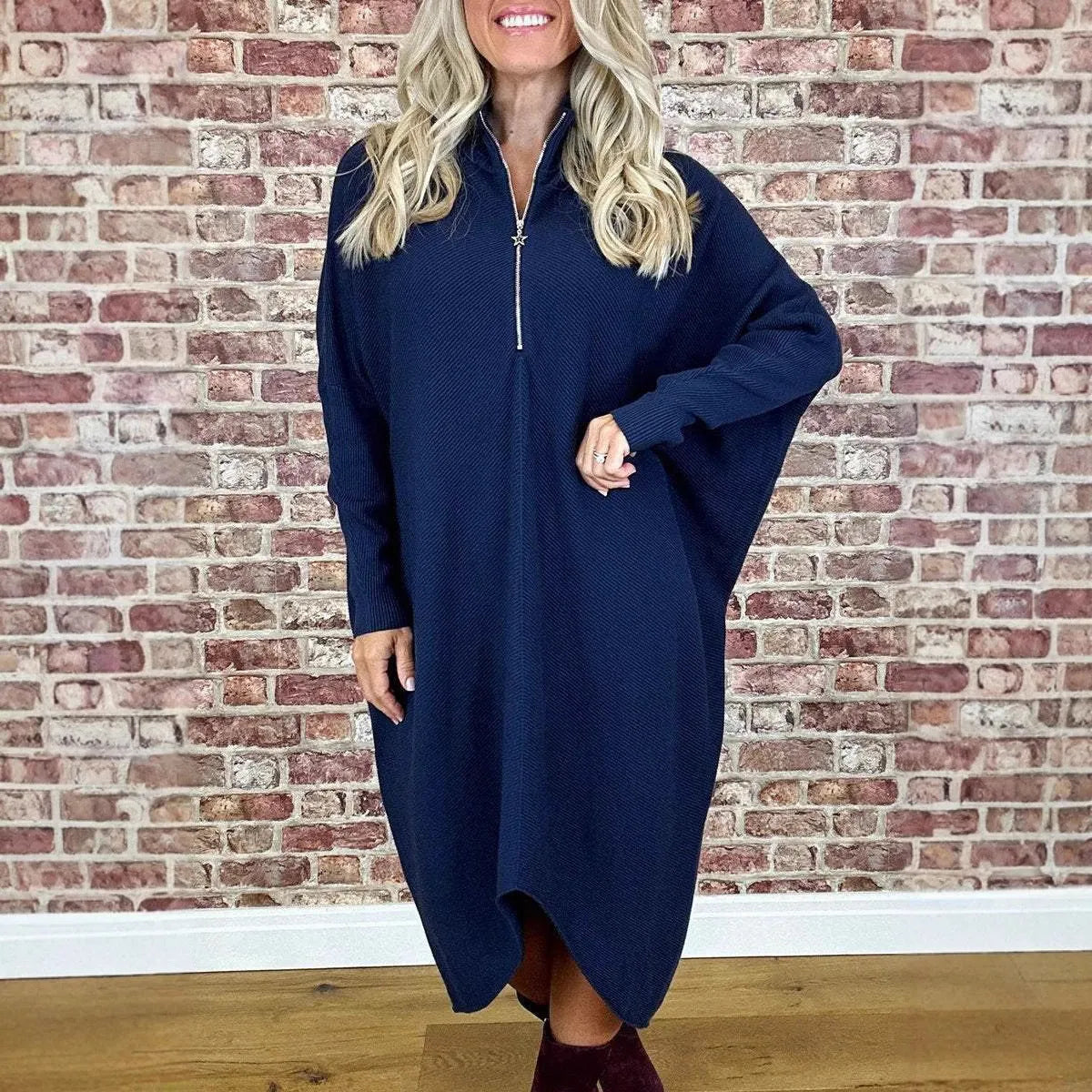 Women's solid colour loose knitted dress with raglan sleeves shown in dark green