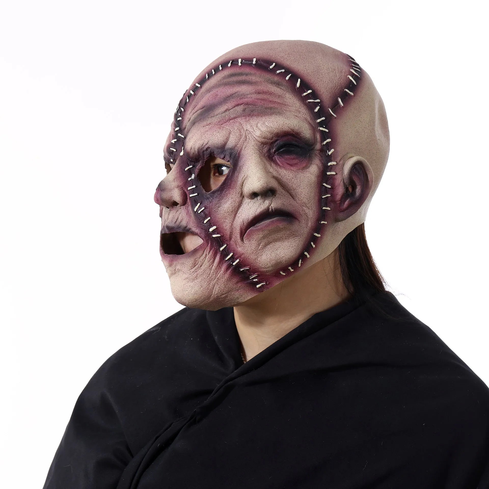 Three-sided grimace horror Halloween mask showing detailed latex texture and facial expression