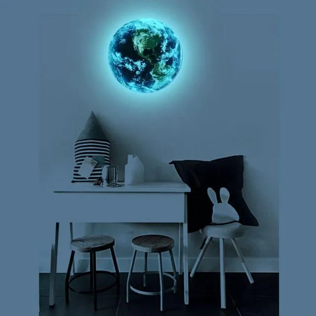 Glow in the dark 3D Earth planet wall sticker in multiple sizes on a dark wall.