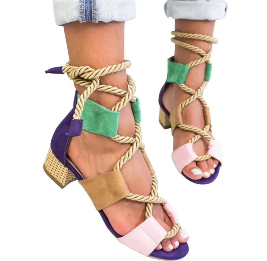 Women's beige suede sandals with a fish mouth toe, front strap, and ankle strap, featuring a thick middle heel.