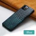 Black crocodile pattern leather back cover case for an iPhone on a wooden surface.