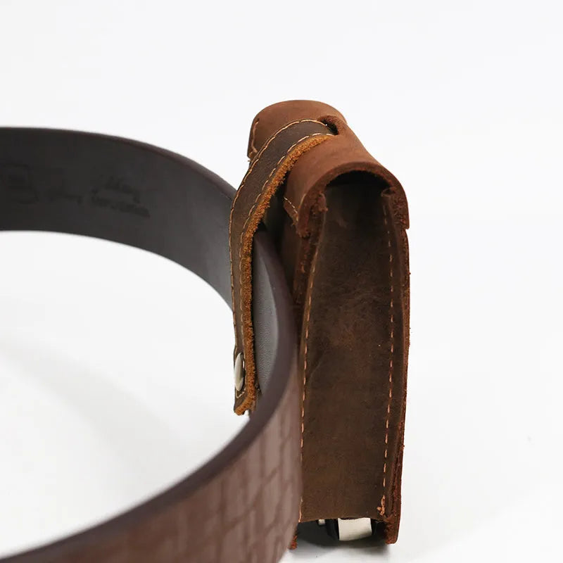 Crazy horse leather key case in dark brown, 7cm by 11.5cm, resting on a surface