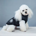 Waterproof dog coat with integrated harness in red colour on Labrador dog