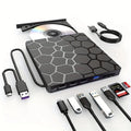 Black external USB CD DVD drive optical disc writer reader burner on a desk.