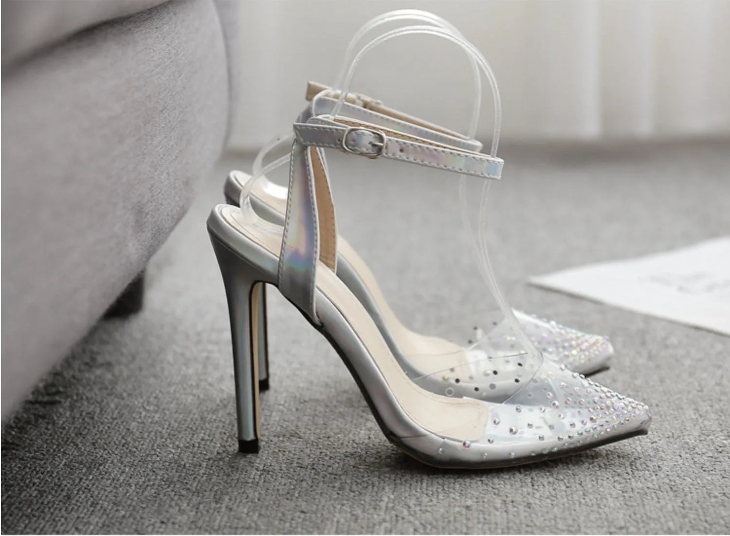 Women's pointed toe stiletto sandals with diamond embellishments on PVC upper, showing side view