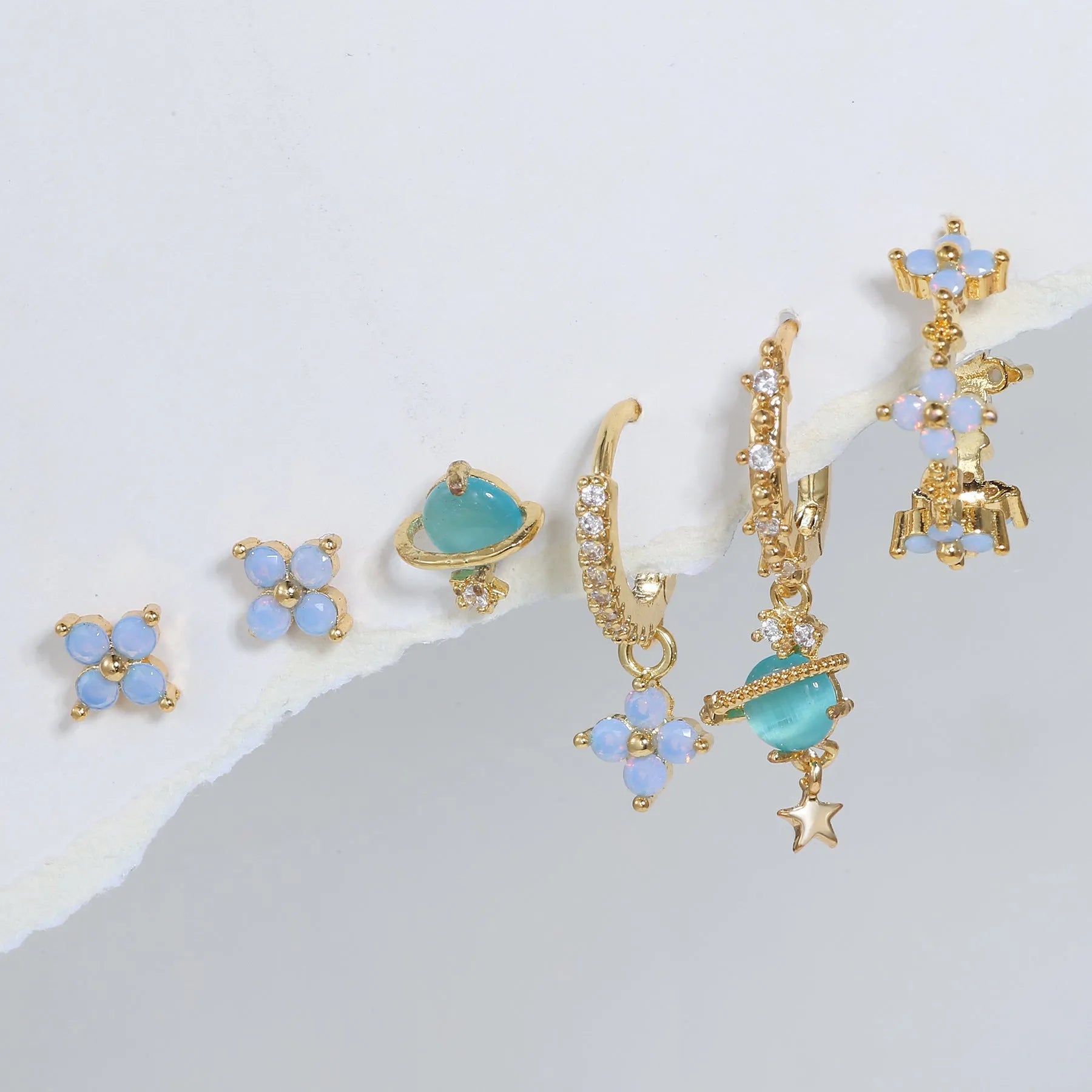 Gold and silver floral ear studs with zircon mosaic stones and geometric metal design