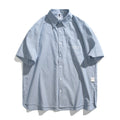 Blue and white striped short-sleeved cardigan-style shirt on a hanger