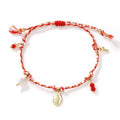 Ethnic style hand-woven bracelet made from colourful braided rope on woman's wrist