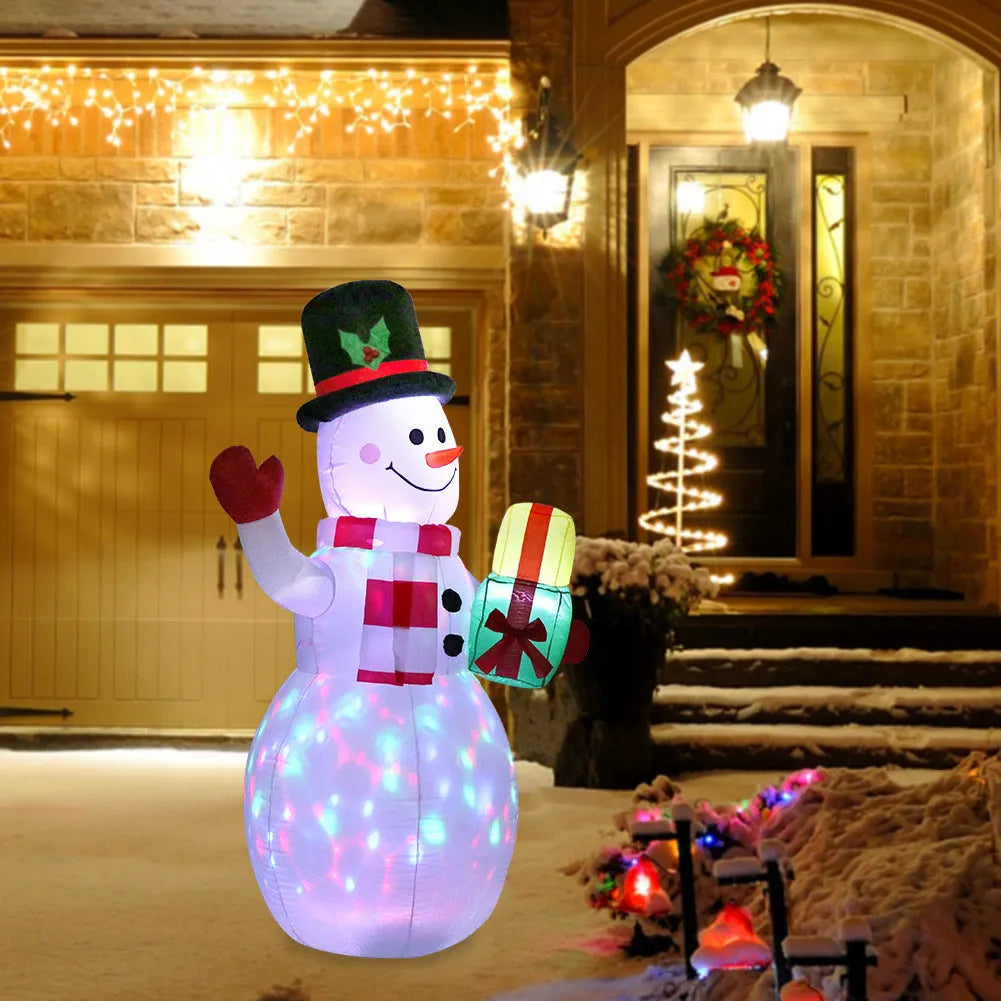 Christmas LED inflatable decoration of a glowing Santa Claus figure in a garden at night