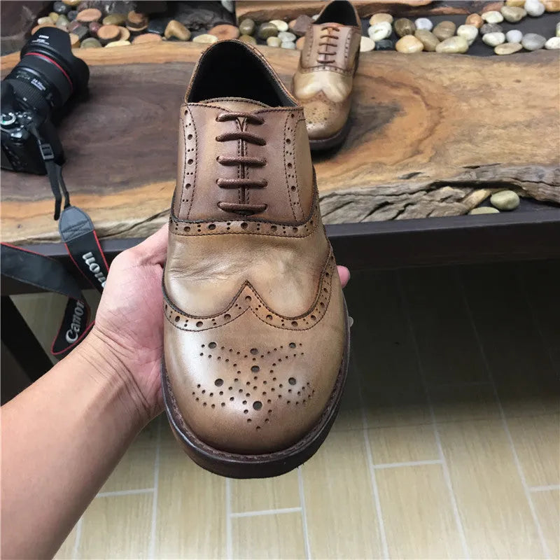 Men's light brown vintage leather shoes with engraved distressing and lace-up closure