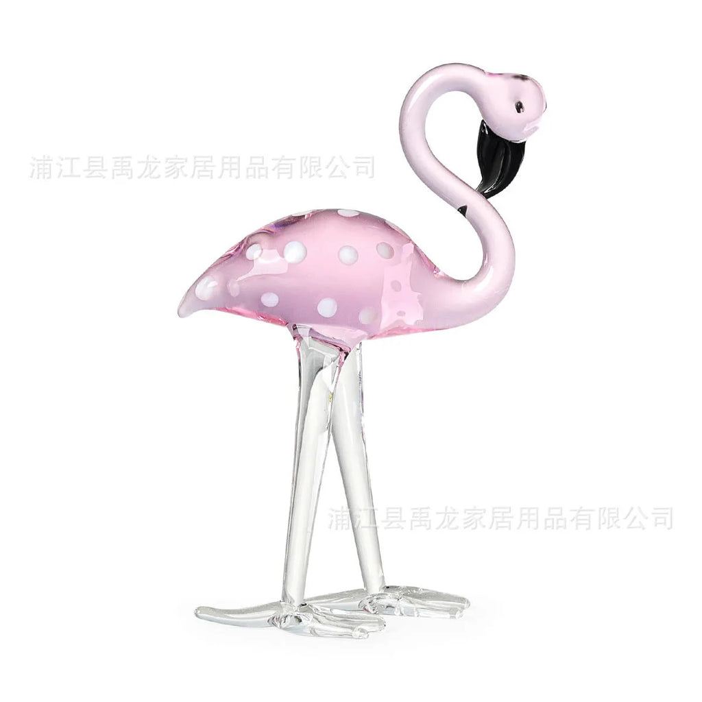 Pink crystal flamingo decorative ornament on a table, modern minimalist style.