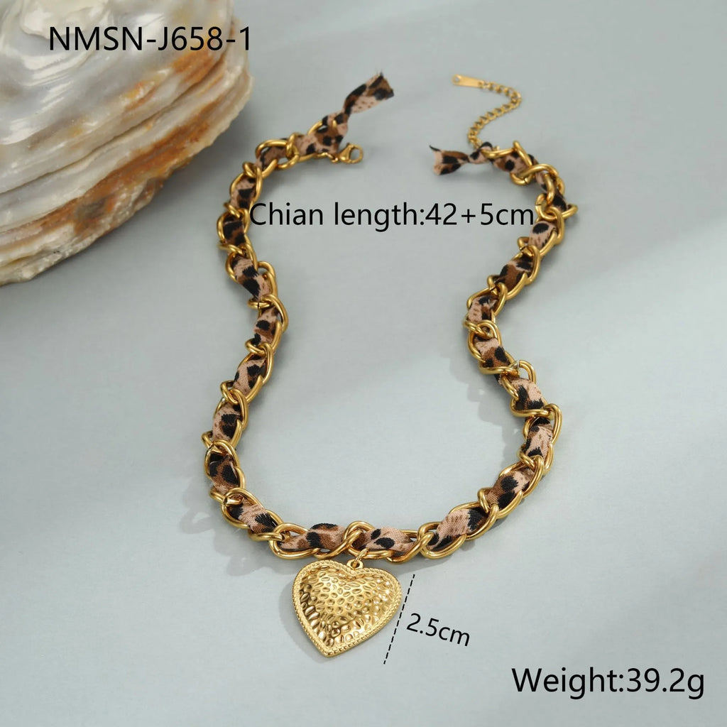 Leopard Love stainless steel necklace with geometric heart or sun pendant on a gold plated adjustable chain.