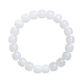 White Hetian jade barrel bead bracelet on a wrist, showing smooth oval beads on a string.