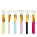 Reusable silicone face and body mask applicator spatula tool in one of six colours: black, blue, pink, rose red, white, or yellow.