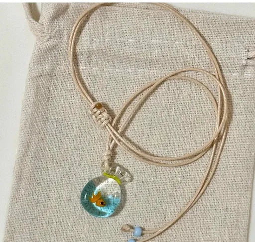 Women's coloured glaze small fish lucky bag pendant on a cotton linen clavicle chain necklace.