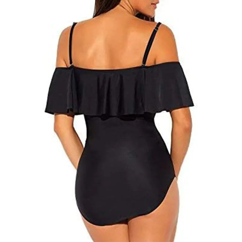 Black one-piece swimsuit with cut-out detailing and ruffled strap tube top design