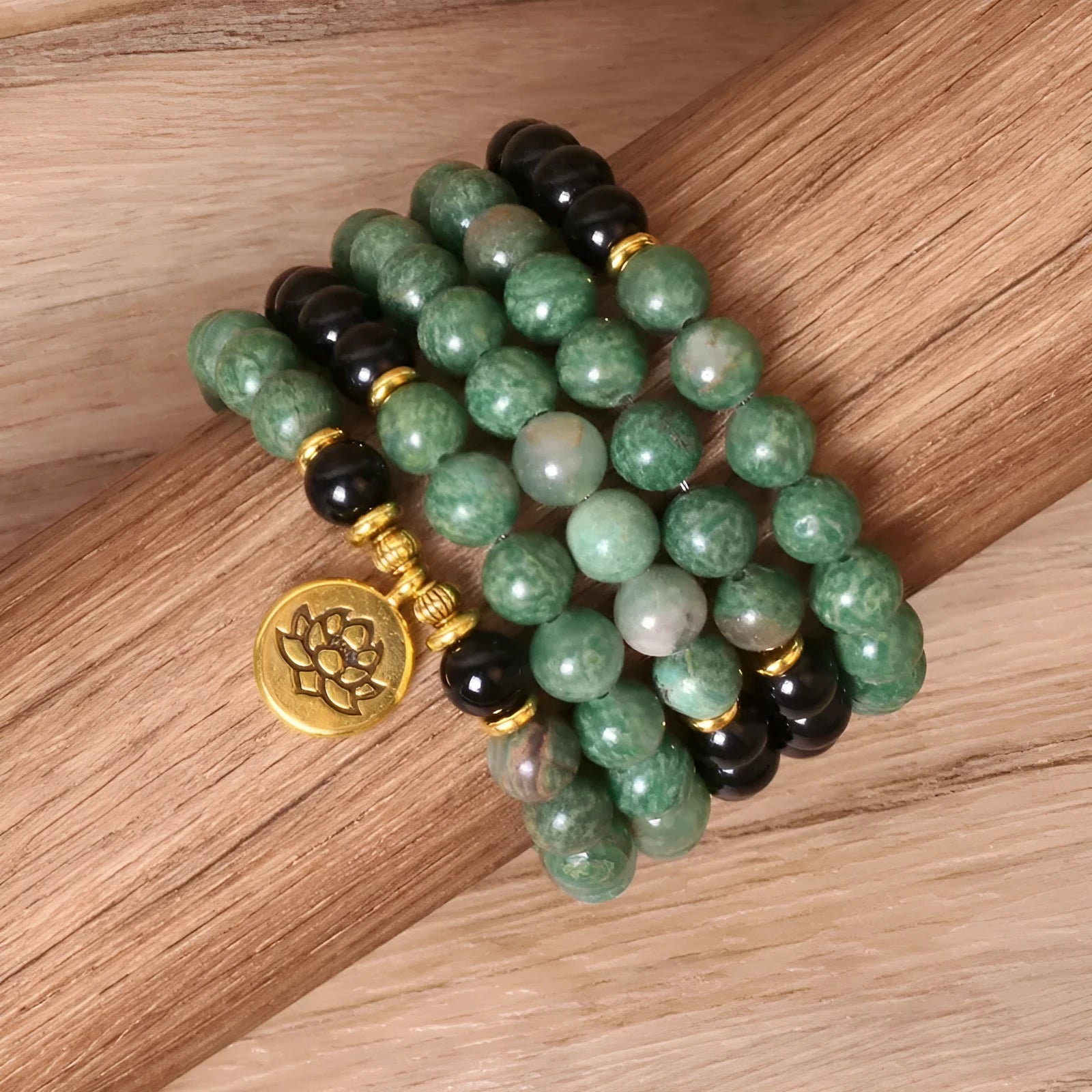 Green and black alloy beads on a stretch elastic bracelet band.