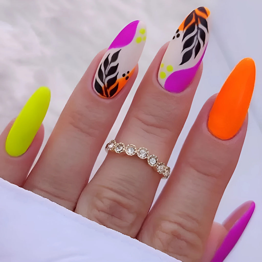 Wear Armour medium almond shaped nail stickers in four frosted patterns: French leaves, leopard print, macarons, and colour plating.