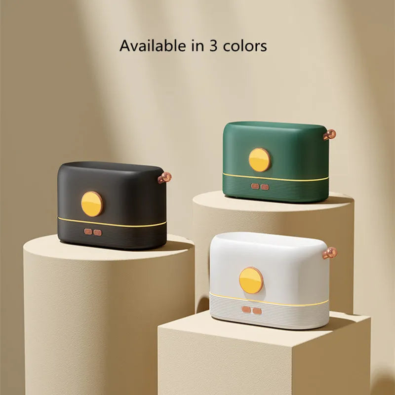 Black USB-powered desktop humidifier with glowing orange flame effect and water vapour mist.