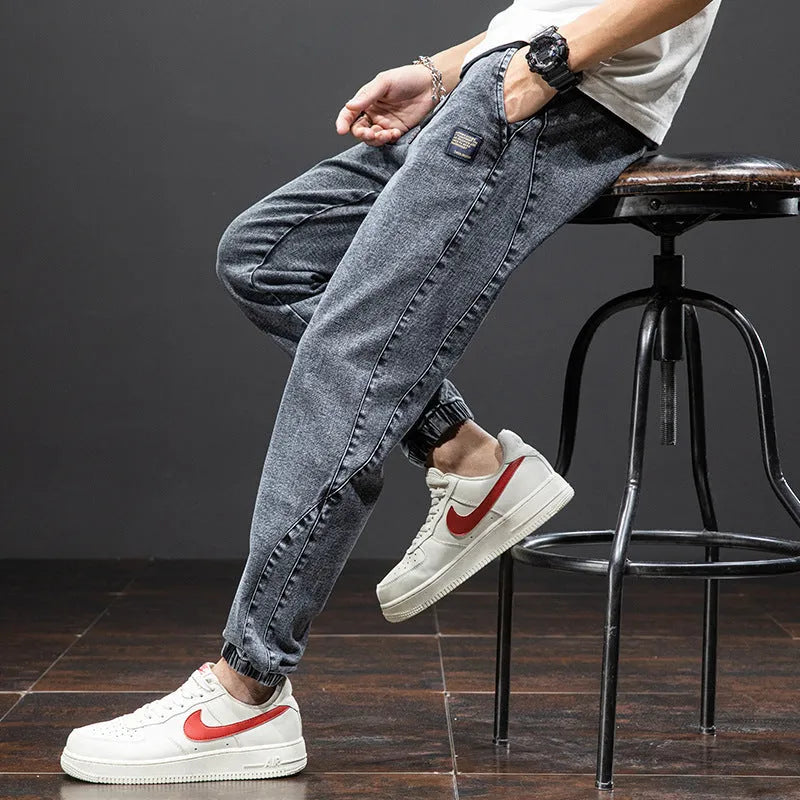 Men's loose fit straight leg cargo jeans in cotton with micro elasticity, shown in blue.