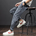 Men's loose fit straight leg cargo jeans in cotton with micro elasticity, shown in blue.